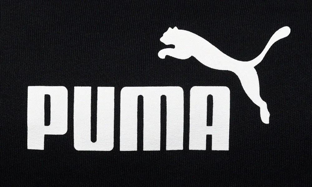 Puma brand logo with the leaping-cat mark and blocky PUMA wordmark in white on black
