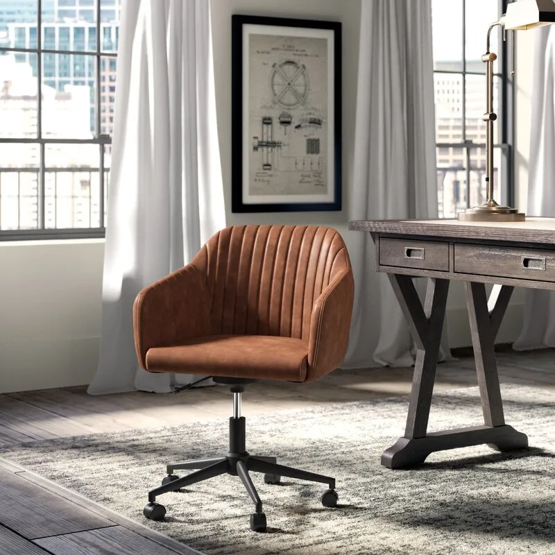 Interior inspiration — tan leather channel-tufted office chair on casters beside a dark wood desk