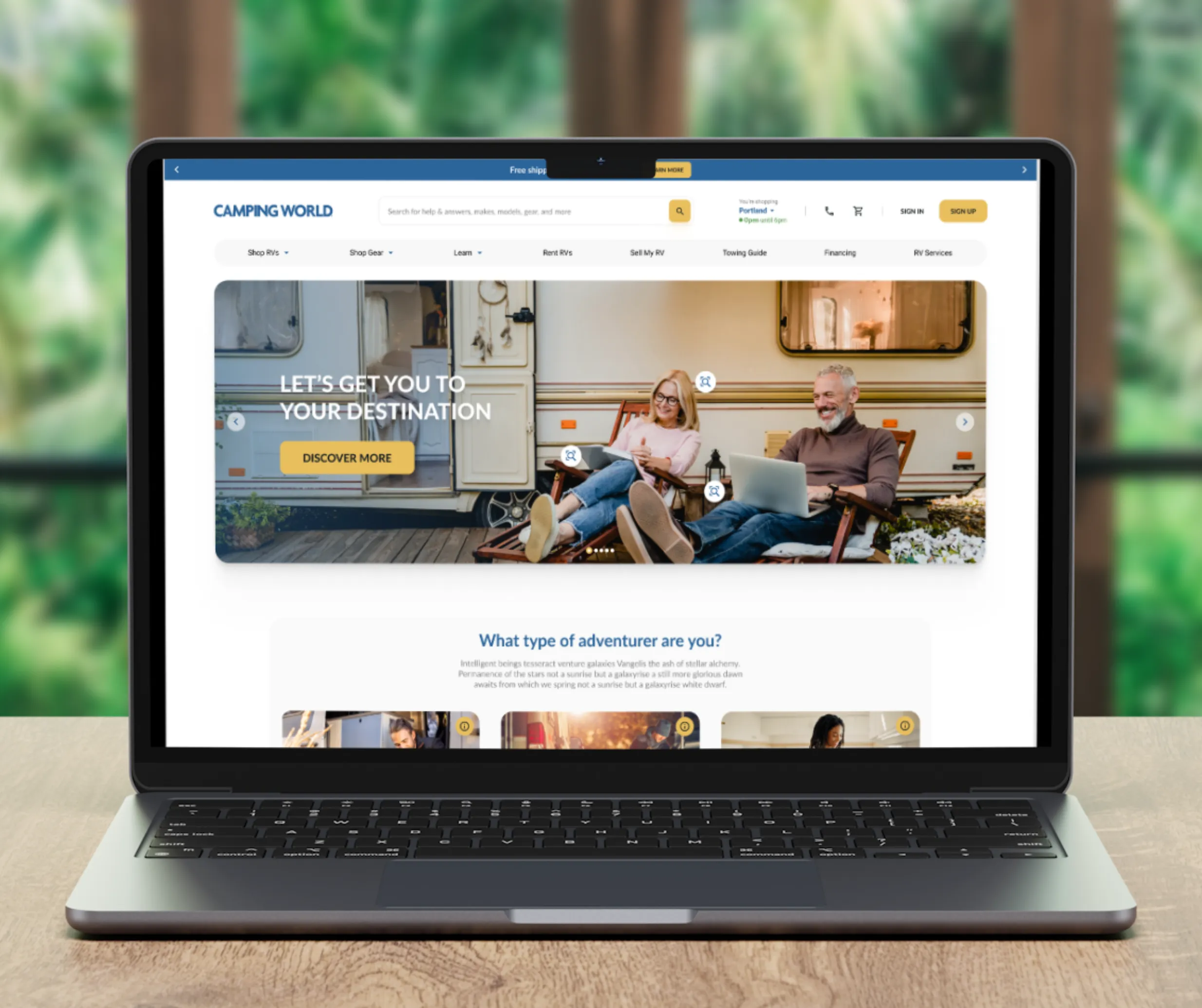 Laptop mockup of the redesigned Camping World homepage with a couple relaxing by an RV and a 'What type of adventurer are you' section