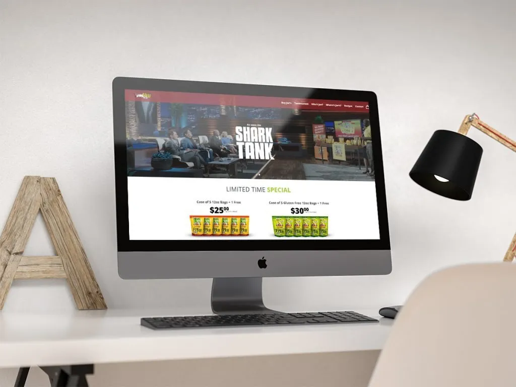 Mockup of Joe's Gourmet Shopify homepage on an iMac, showing an 'As seen on Shark Tank' banner and a limited-time special on snack bag cases
